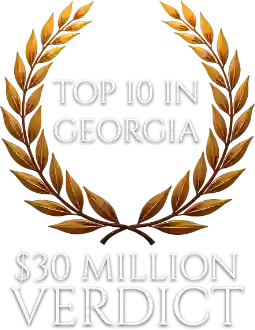 laurel-wreath_4 haug barron law group | atlanta personal injury attorneys haug barron law group | atlanta personal injury attorneys Gold laurel wreath badge reading'Top 10 in Georgia' and '$30 Million Verdict'.